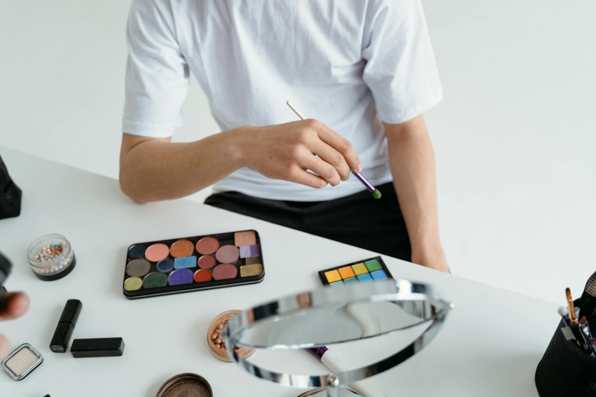 Close Up Of A Person Applying Makeup With